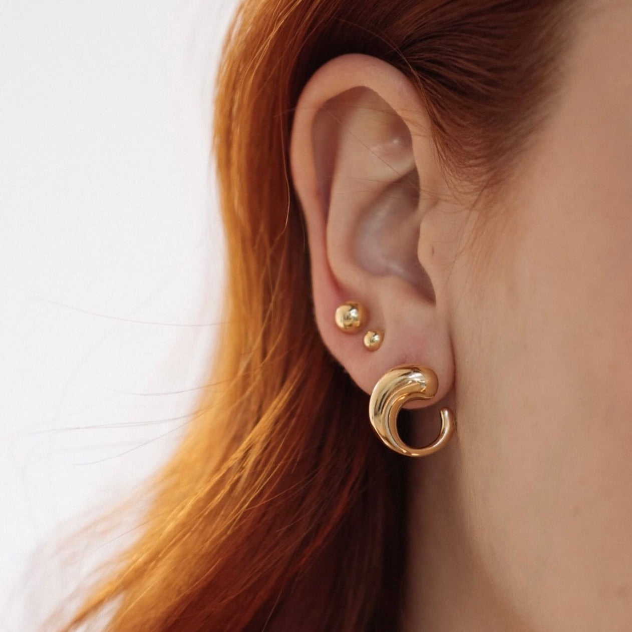 Modern Gold Wave Stud Earrings